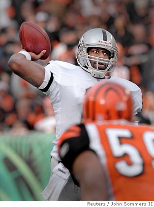 Cincinnati Bengals running back Rudi Johnson (L) fumbles the ball