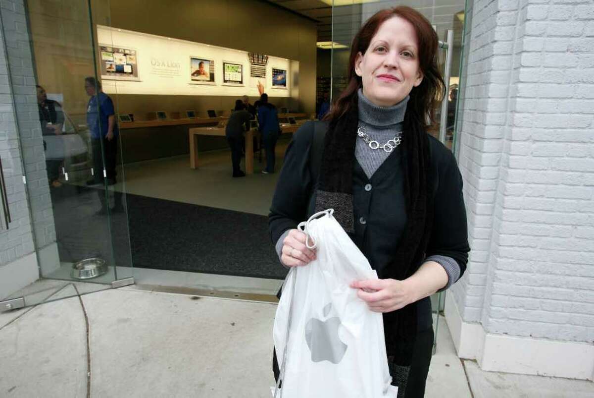 Jean Garten, of Scarsdale, N.Y., purchased one of the new Apple iPads at the Apple Store on Greenwich Avenue for her nephew Friday, March 16, 2012.