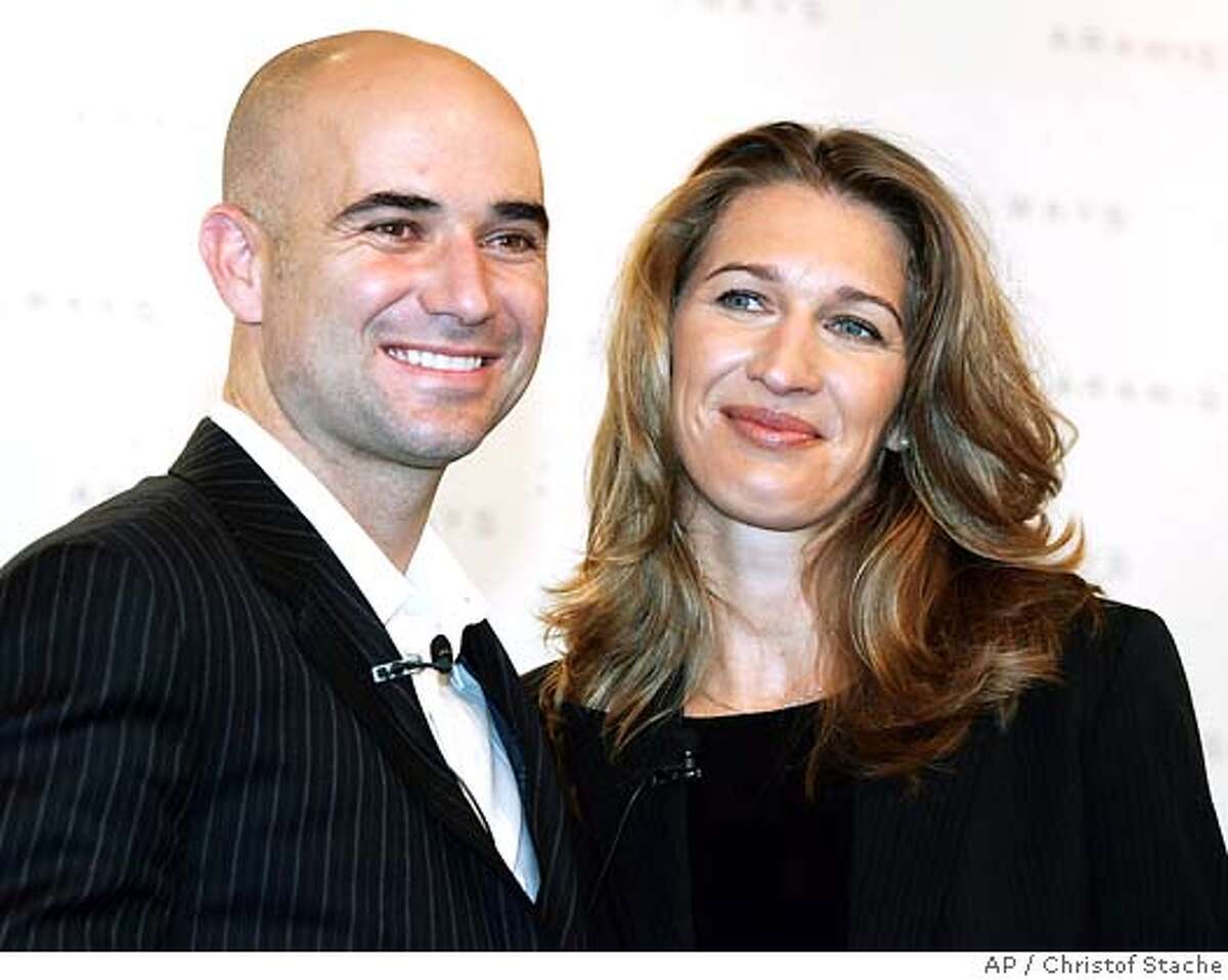 ** FILE ** Former German tennis star Steffi Graf and her husband U.S. tennis player Andre Agassi pose for photographers during a presentation of a fragrance in Munich, southern Germany, on Oct. 24, 2005. Turning what was expected to be a routine pre-Wimbledon news conference into something significant, Agassi announced Saturday, June 24, 2006, he will retire after this year's U.S. Open, leaving tennis after two decades. (AP Photo/Christof Stache) Ran on: 07-16-2006 Andre Agassi and wife Steffi Graf have started a development company that focuses on luxury homes and resorts. Ran on: 07-16-2006 Andre Agassi and wife Steffi Graf have started a development company that focuses on luxury homes and resorts. Ran on: 09-26-2006 Tennis star Andre Agassi, who retired earlier this month, has set up a time-share company with his wife, Steffi Graf. FILER