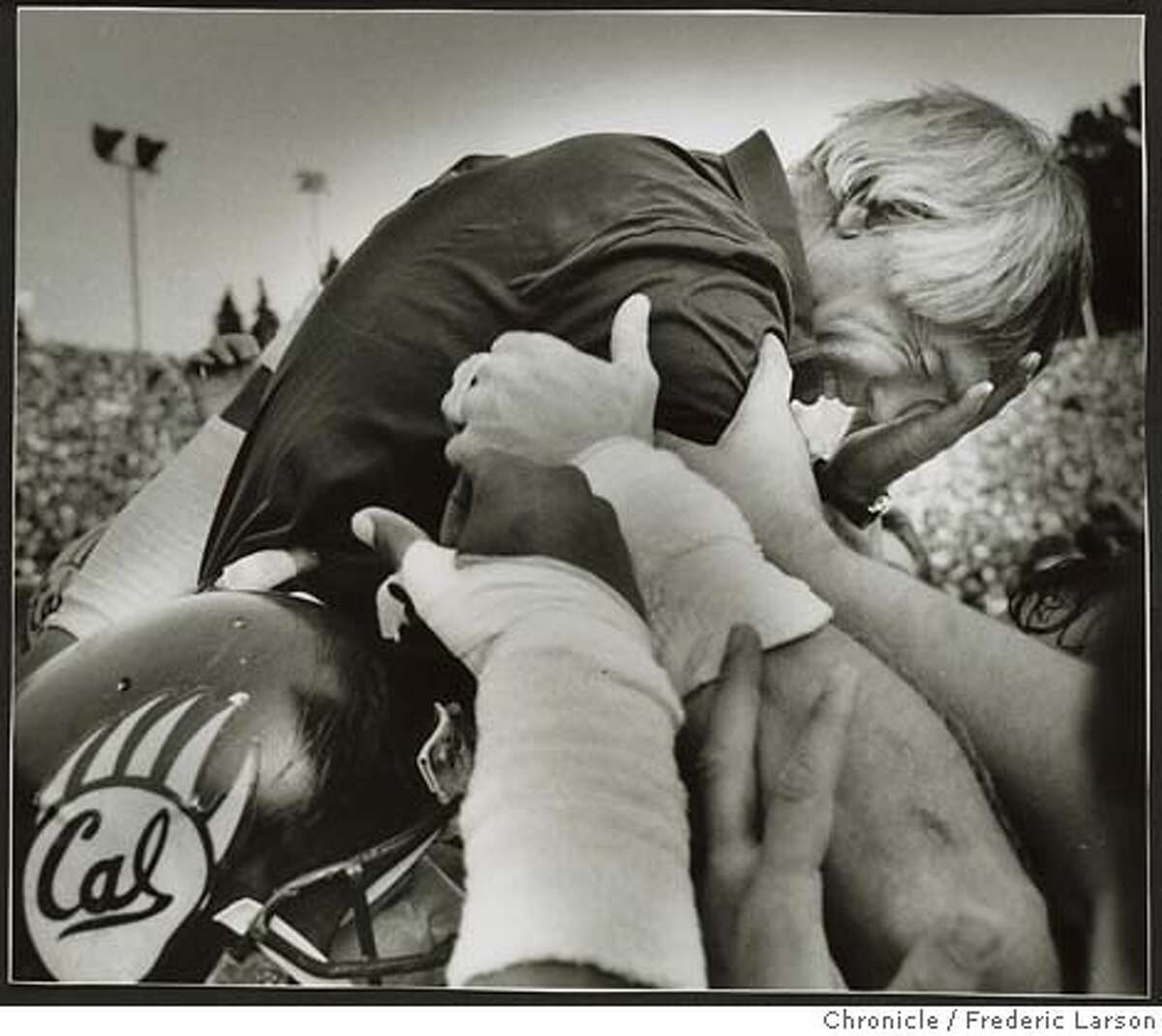 Joe Kapp face showing emotion as he is carried off the field by players. Cal wins Big Game over Stanford. 11/22/86