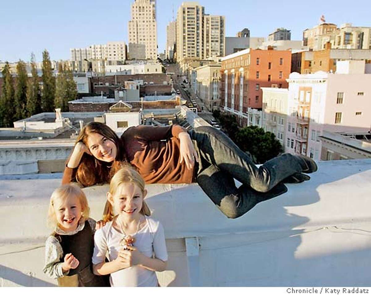 LANDLORDS26_075_RAD.jpg SHOWN: Tina Warren and her two daughters, Lucie, age 2, and Isabel, age 6, on the roof of their building at 801 Sutter. The best thing, Tina says, about this duplex apartment is the roof access. Tina and her husband, Ben, and their family have lived in the two-bedroom duplex at the top of 801 Sutter for four years, and Tina has lived in the building since 1989! Story is about how at least one landlord in SF is not going to raise rents in the building at 801 Sutter St.---Matthew Hallinan, manager of the ValeyHallinan Properties believes in building communities foremost, and is determined to keep his rents low. These pictures were made on Tuesay, Nov. 21, 2006, in San Francisco, CA. (Katy Raddatz/SF Chronicle) *Matthew Hallinan, Tina Warren, Isabel Warren, Lucie Warren Mandatory credit for the photographer and the San Francisco Chronicle. ; mags out.
