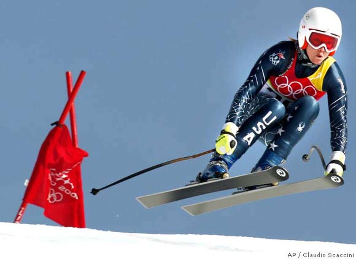 �Julia Mancuso of the United States takes a jump during the Women's Super-G at the Turin 2006 Winter Olympic Games in San Sicario Fraiteve, Italy, Monday, Feb. 20, 2006. (AP Photo/Claudio Scaccini)Ran on: 02-23-2006