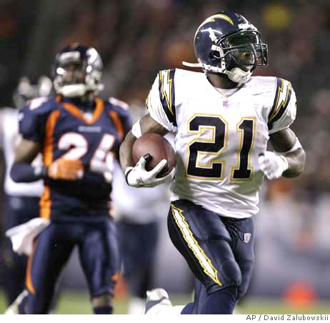 San Diego Chargers running back LaDainian Tomlinson (21) heads to the end  zone on a 51-yard touchdown catch during the third quarter of a NFL  football game against the Denver Broncos, Sunday