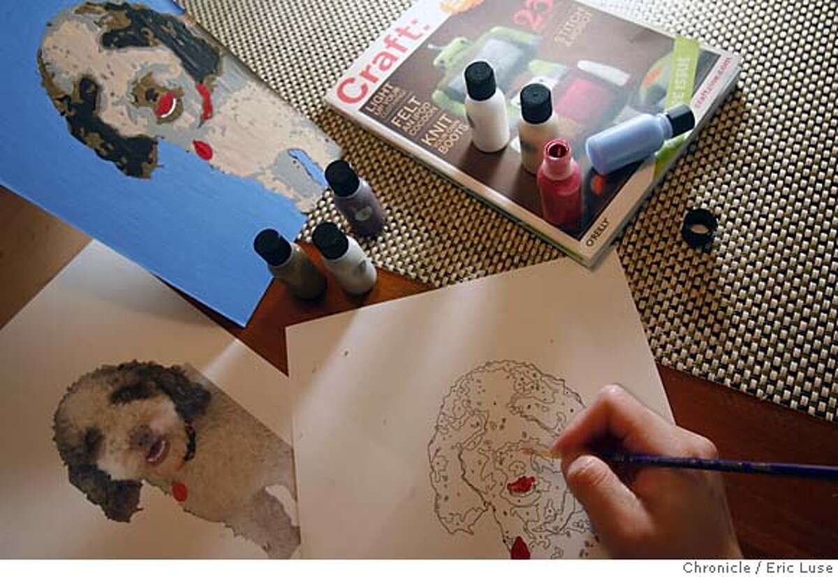 crafts_066_el.JPG Le paints on Paint by Numbers which uses photoshop to enable a drawing from a photo which allows a numbering system to then paint as scene in the background of a family dog named Dulce. Anh-Minh Le working on ideas from Craft magazine. Photographer: Eric Luse / The Chronicle names cq with source MANDATORY CREDIT FOR PHOTOG AND SF CHRONICLE/ -MAGS OUT