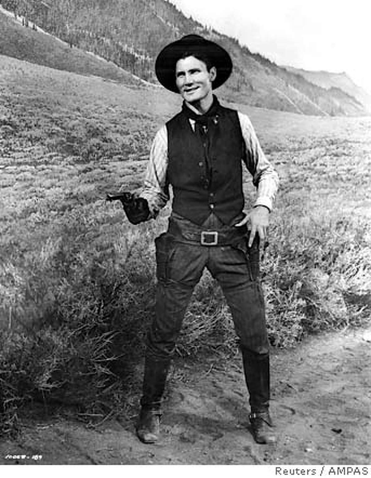 Jack Palance appears in this undated publicity photo as co-star of the 1953 western "Shane," directed by George Stevens. Oscar-winning actor Palance, who starred as a heartless gunslinger in "Shane," died at his California home on November 10, 2006 at age 87, his spokesman said. NO ARCHIVES EDITORIAL USE ONLY REUTERS/AMPAS/Handout (UNITED STATES)