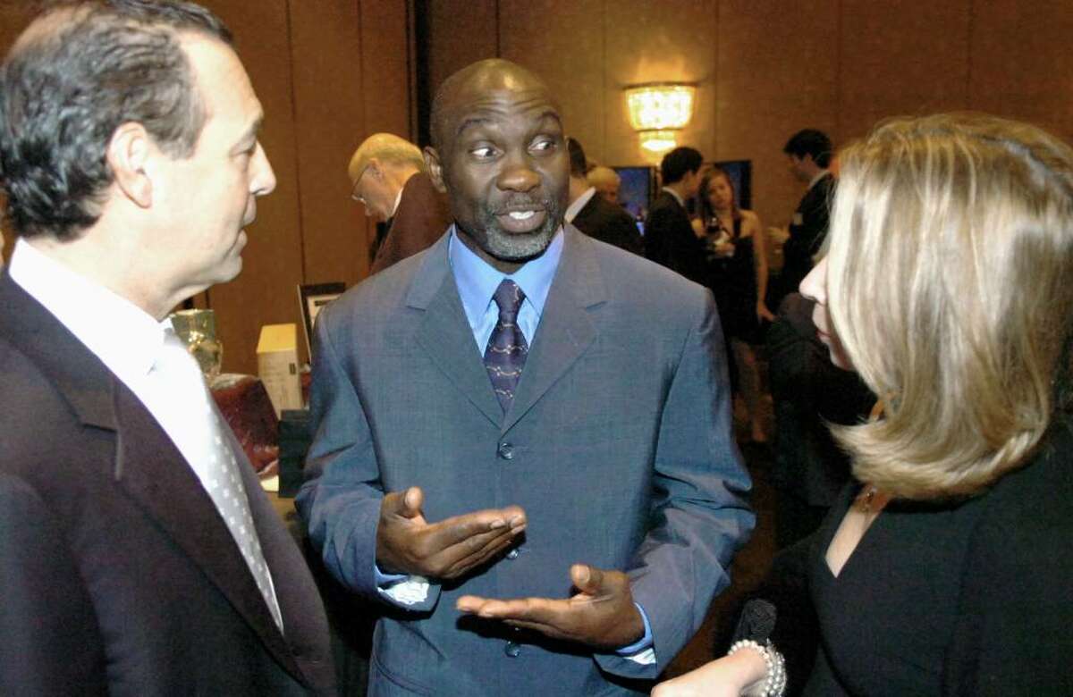 William Hayward “Mookie” Wilson, inductee to the New York Mets Hall of Fame, chats with longtime Mets fans Marc and Susan Peyser during the 31st Multiple Sclerosis Dinner of Champions at the Hyatt Regency in Old Greenwich Thursday evening, Nov. 12, 2009. Wilson received the 2009 J. Walter Kennedy Award.