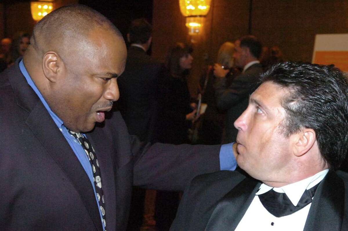 Former New York Giants running back Joe Morris chats with Chris Timpanelli during the 31st Multiple Sclerosis Dinner of Champions at the Hyatt Regency in Old Greenwich Thursday evening, Nov. 12, 2009. Morris was named by the National MS Society, Connecticut Chapter to receive the 2009 J. Walter Kennedy Award. Timpanelli. 49, was diagnosed with MS when he was 28.