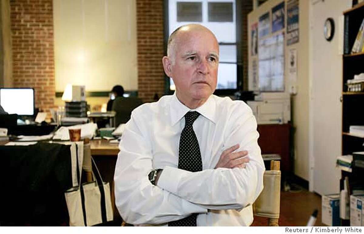 Oakland Mayor Jerry Brown sits in his campaign office in Oakland, California October 12, 2006. Brown, nicknamed California's "Governor Moonbeam" in the 1970s for his unconventional ideas, at age 68 seeks to cap an unusual political career by becoming the state attorney general. Picture taken October 12, 2006. REUTERS/Kimberly White (UNITED STATES)