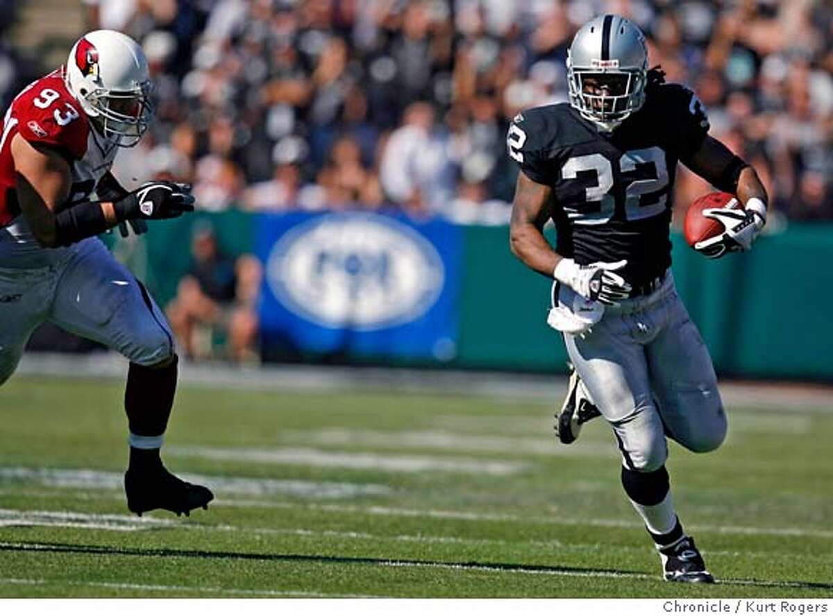 FILE ** Oakland Raiders fullback Zack Crockett (32) is tackled by