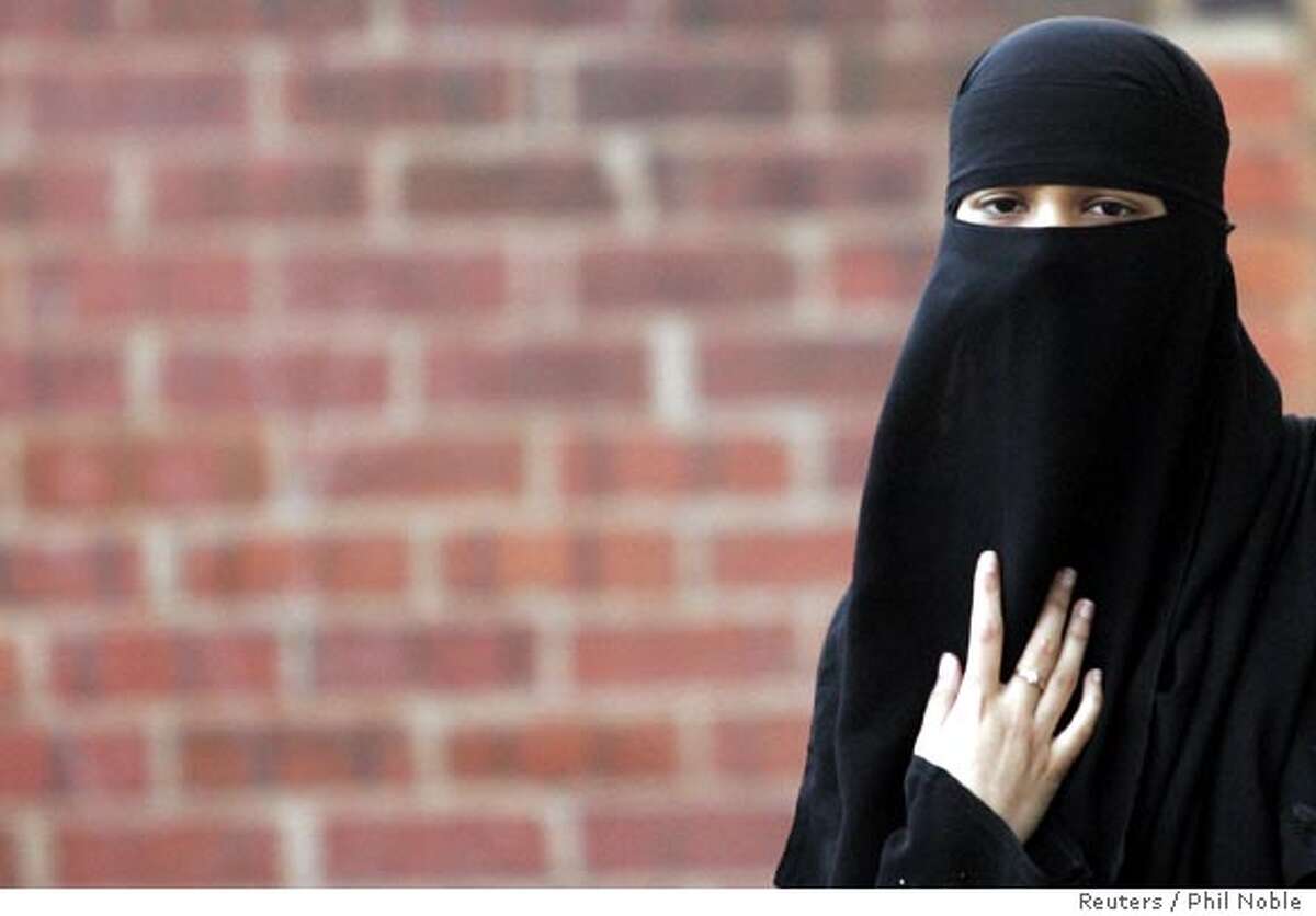 Asma Patel, a local Muslim, wears a veil known as a niqab, as she arrives for a constituency meeting with Britain's Leader of the House of Commons Jack Straw in Blackburn, northern England, October 13, 2006. Straw is meeting constituents for the first time since claiming that the facial veils of women can make community relations more difficult. REUTERS/Phil Noble (BRITAIN) Ran on: 10-18-2006 Asma Patel wears the full-face veil, or niqab, which has aroused controversy in Britain. Ran on: 10-22-2006 Young girls at a school in Beni Suef, Egypt, 150 miles south of Cairo, wear the hijab, a head scarf worn by some Muslim women.