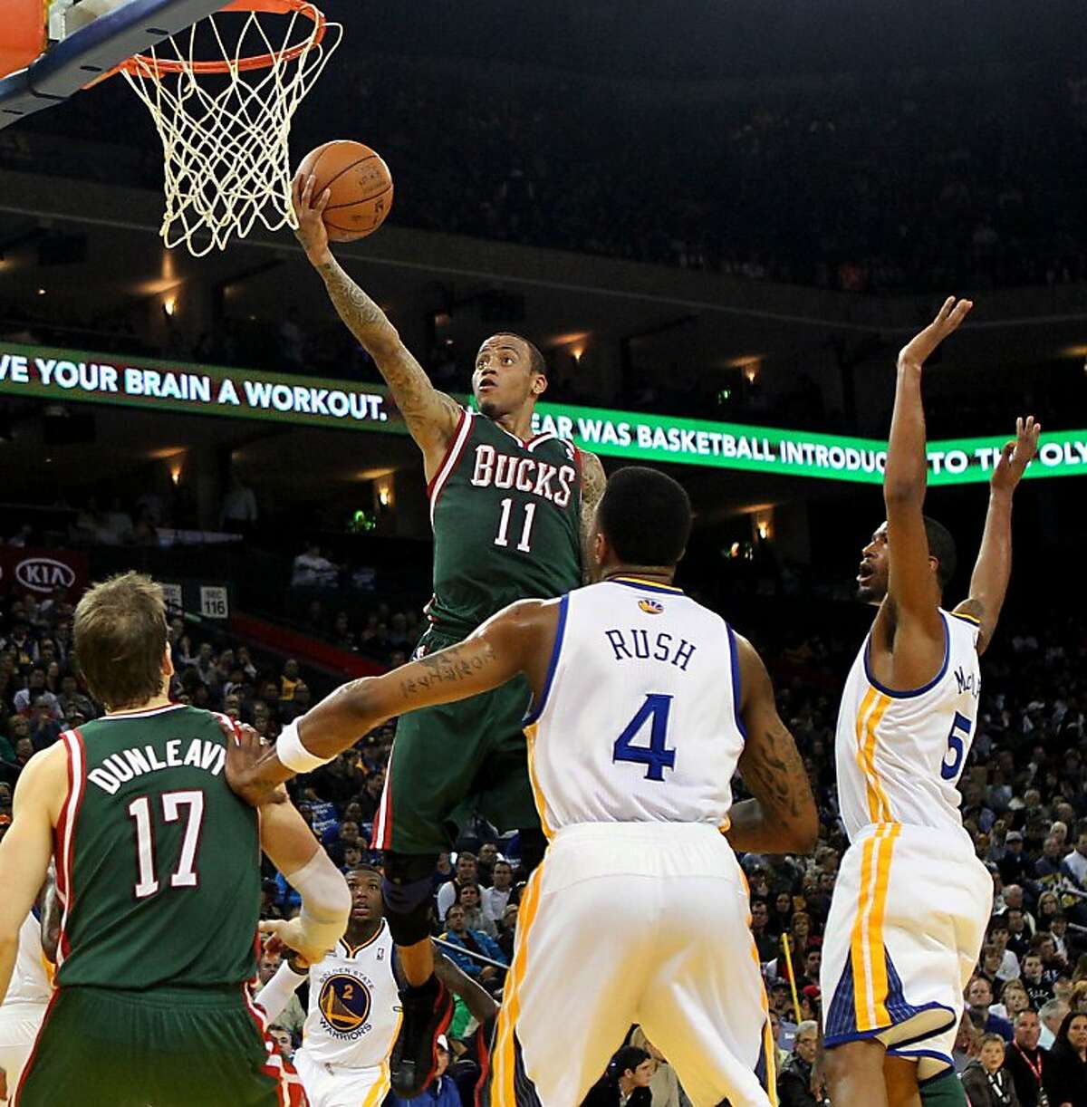 Milwaukee Bucks' Monta Ellis scores over his old teammates during the first half of their game NBA basketball game with Golden State Warriors, Friday, March 16, 2012, in Oakland, Calif.