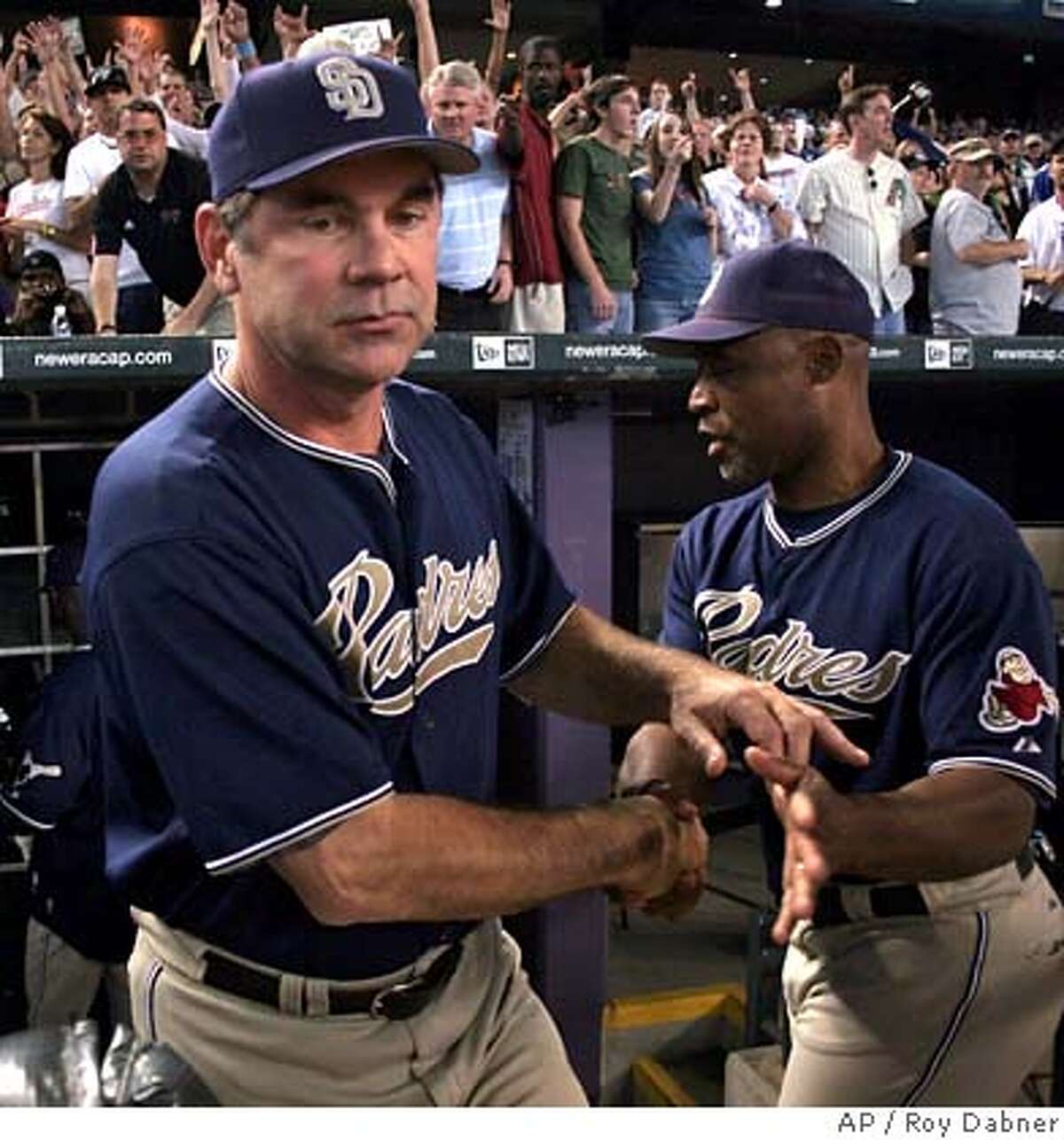 San Diego Padres manager Bruce Bochy, left, is congratulated by coach Ty Waller, following the Padres 7-6 win over the Arizona Diamondbacks, to win the National League West, Sunday, Oct. 1, 2006 in Phoenix. (AP Photo/Roy Dabner) EFE OUT
