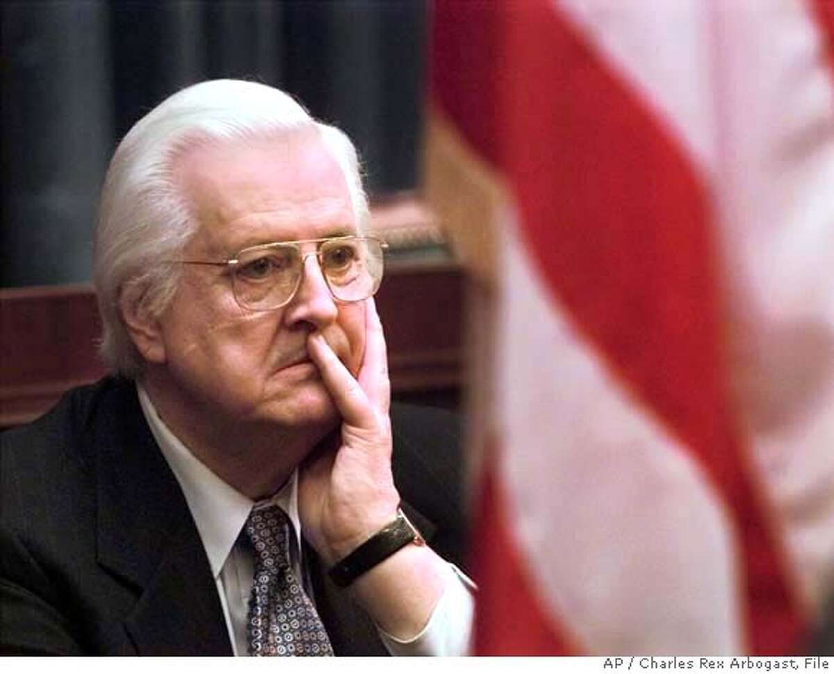 House Judiciary Committee Chairman Rep. Henry Hyde, R-Ill., watches as fellow committee members meet reporters on Capitol Hill Friday Feb. 12, 1999, after the Senate voted to acquit President Clinton on two articles of impeachment. (AP Photo/Charles Rex Arbogast) w/3probe20