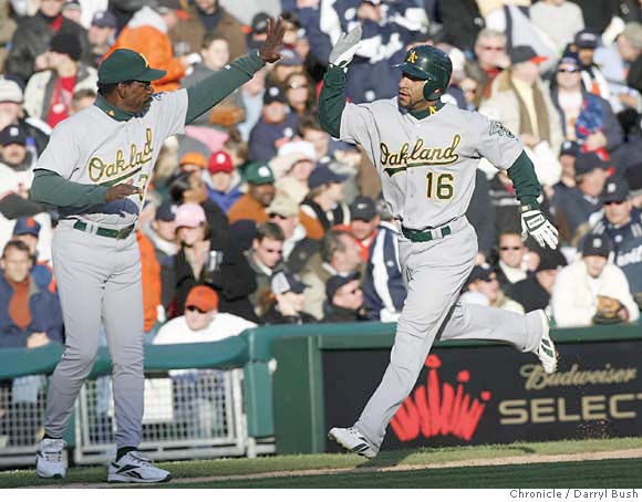 D'Angelo Jiminez gives Nick Swisher of the Oakland Athletics a