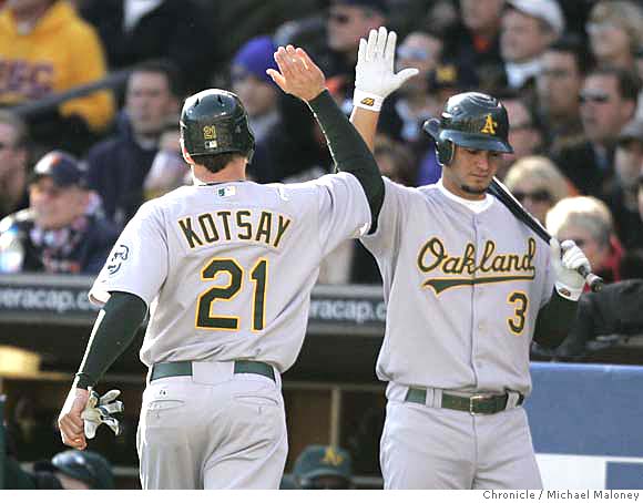 Detroit Tigers' Ivan Rodriguez, left, celebrates with Placido