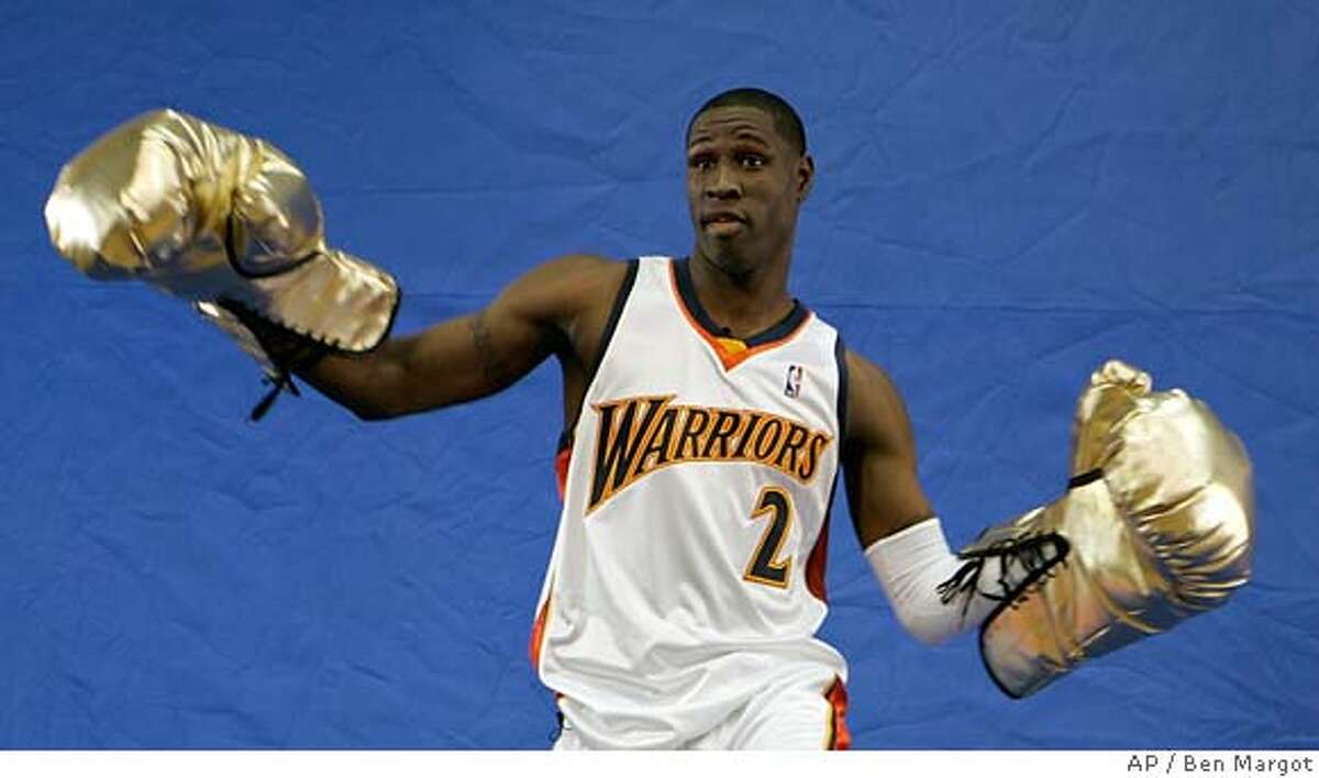 Golden State Warriors' Mickael Pietrus of France, wears oversized boxing gloves during a film shoot on media day Monday, Oct. 2, 2006, in Oakland, Calif. (AP Photo/Ben Margot) EFE OUT