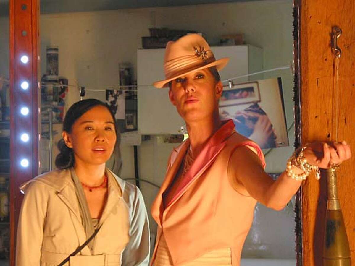 (NYT53) UNDATED -- Sept. 20, 2006 -- FILM-SHORTBUS-ADV24-3 -- Sook-Yin Lee, who plays a sex therapist, left, with Justin Bond as an emcee/host of a club, pictured in this frame from John Cameron Mitchell's movie, entitled "Shortbus." (Courtesy of ThinkFilms/The New York Times) *Only for use with story by Frank Bruni entitled FILM-SHORTBUS-ADV24. All other use prohibited XNYZ -- *Only for use with story by Frank Bruni entitled FILM-SHORTBUS-ADV24. All other use prohibited