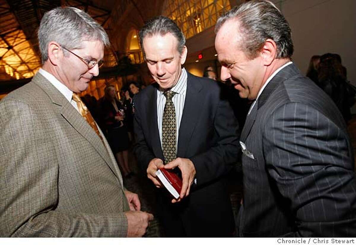 michelin_163_cs.jpg Michael Ian Fanning (left), vice-president of corporate affairs for Michelin North America, Inc., famed Napa Valley chef Thomas Keller (center), winner of three Michelin stars, and Jean-Luc Naret (right), director of the Michelin Guide, look for Keller's rating in the guide at the unveiling tonight, October 2, 1006, of the San Francisco Bay Area & Wine Country Michelin Guide in the Grand Hall of the Ferry Building in San Francisco, California. It is the first-ever restaurant and hotel Guide for the West Coast. Chris Stewart / The Chronicle Michelin, Thomas Keller MANDATORY CREDIT FOR PHOTOG AND SF CHRONICLE/ -MAGS OUT