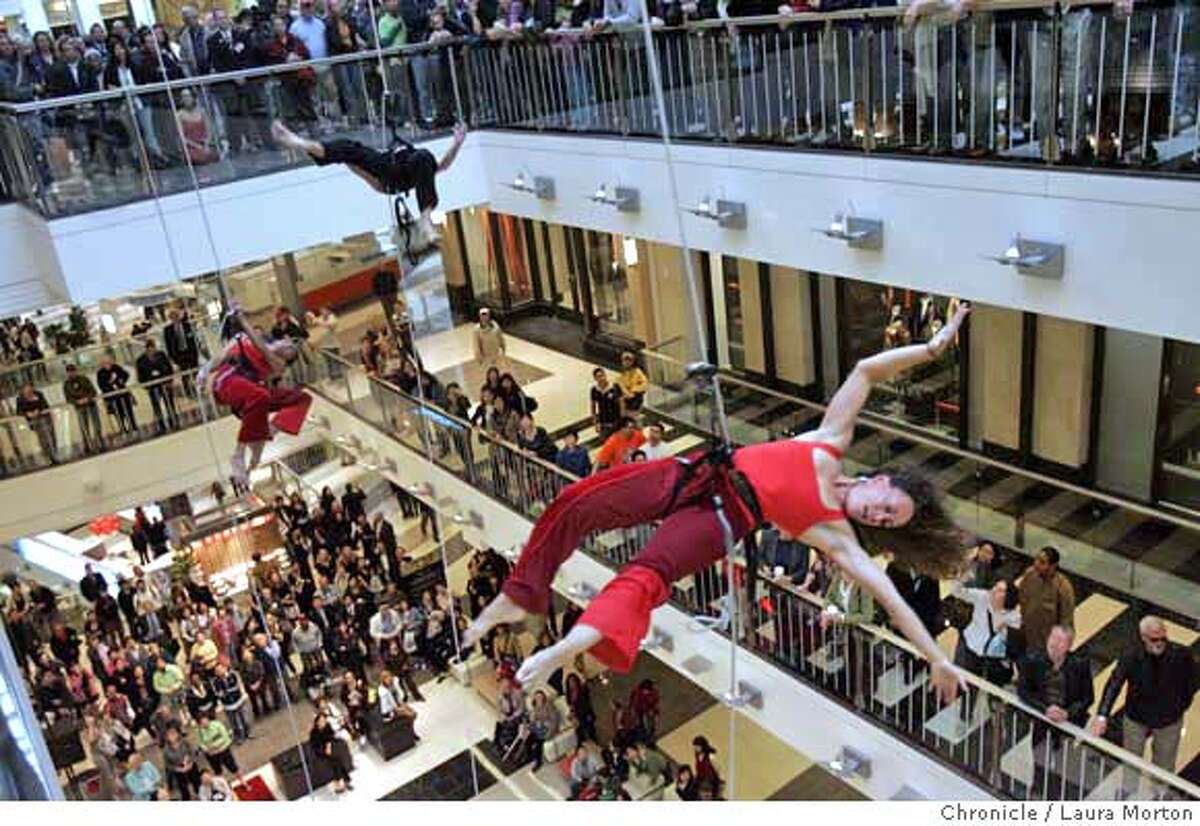Amelia Rudolph (right), artistic director of Project Bandaloop, performs during the opening ceremonies of the Westfield San Francisco Centre expansion on Thursday morning. MANDATORY CREDIT FOR PHOTOGRAPHER AND SAN FRANCISCO CHRONICLE/ -MAGS OUT