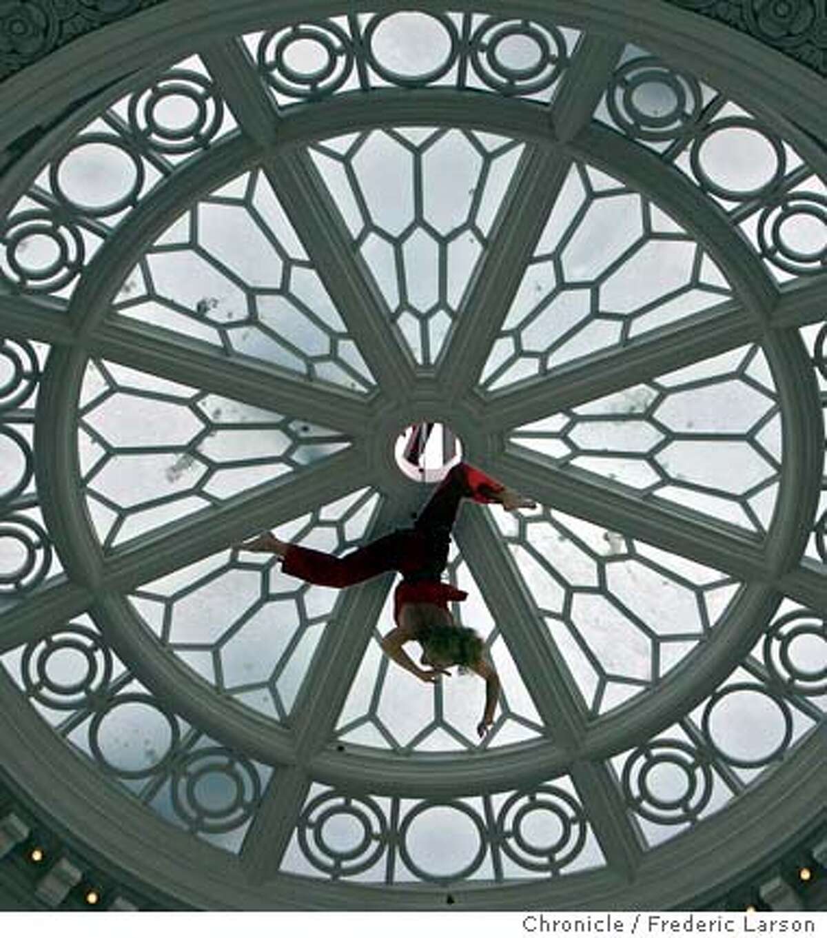 A person desended with a ribbon to cut from the top of the dome of the new mall and Bloomingdale's store which will lure big crowds to the shops, restaurants and movie theaters. But visitors also could encounter traffic jams and parking shortages -- at least during the holidays and big events at Moscone Center. On Wednesday, shoppers attending a special preview of the new Westfield San Francisco Centre found that the Fifth and Mission parking garage was full at midday. Traffic backed up outside the mall because of lines of contractors' trucks and big rigs carrying last-minute merchandise deliveries. No new parking was built to accommodate the 25 million people a year expected to visit the mall, which has tripled in size. The decision not to add parking is in keeping with the city's "transit first" policy, which encourages the use of public transportation. 9/28/06 { / The Chronicle}
