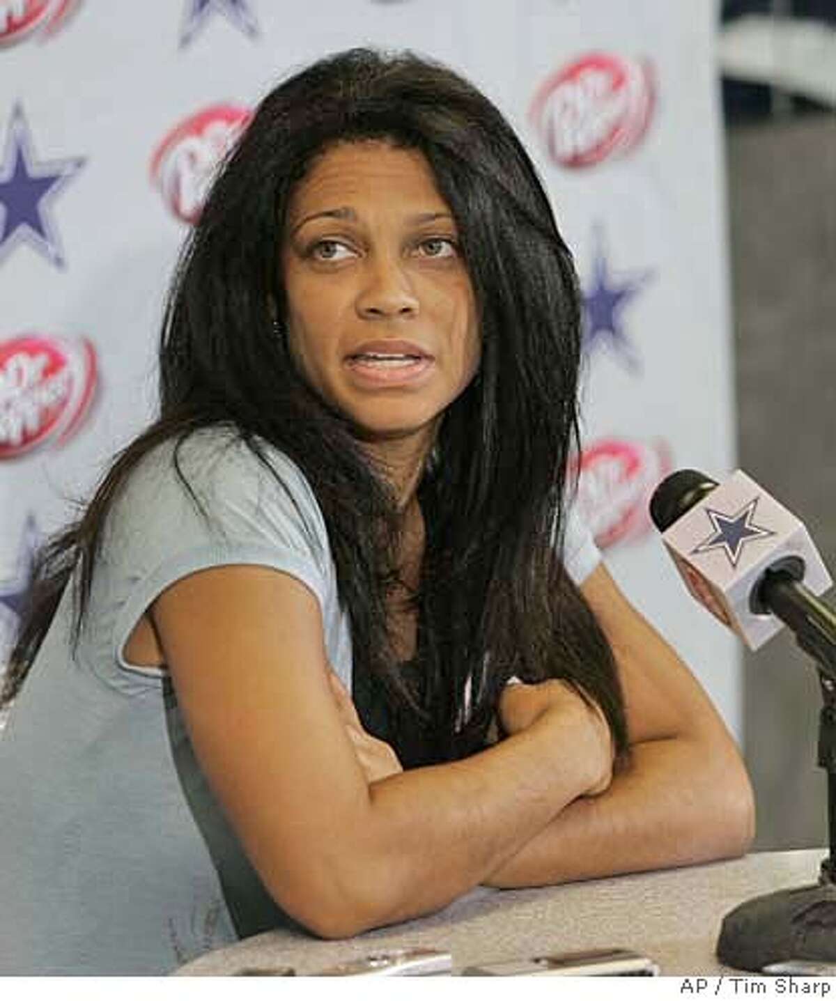 Kim Etheredge, publicist for Dallas Cowboys wide receiver Terrell Owens, responds to a question during a press conference at the Cowboys training facility in Irving, Texas, Wednesday, Sept. 27, 2006.(AP Photo/Tim Sharp)