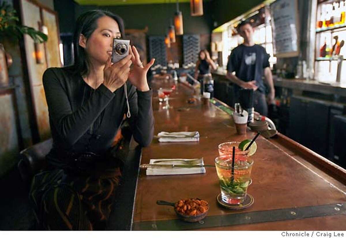FOODPHONE30_015_cl.JPG Photo of Edie Ichioka taking photos of food the eat at restaurants for her food blog at www.bunrab.com. This was at Farmer Brown restaurant at 25 Mason in San Francisco. Craig Lee / The Chronicle MANDATORY CREDIT FOR PHOTOG AND SF CHRONICLE/ -MAGS OUT