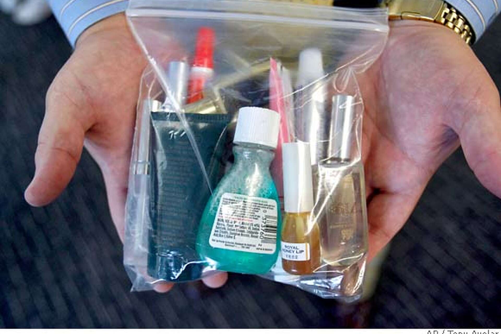 Feds ease restrictions on liquids in carry ons Fliers can have 3 ounce bottles items purchased beyond security
