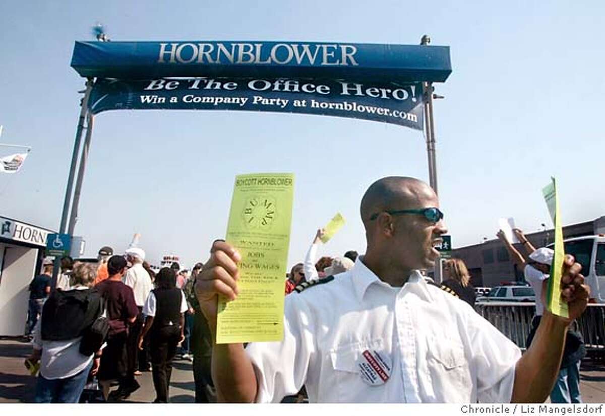 Dushan Crawford, an employee with Blue and Gold Ferry Service, hands out leaflets in front of the Hornblower dock. Protesters were out in front of Hornblower Cruises, which has the new contract the ferry service to Alcatraz. Photographed in SF on Sept. 25th, 2006. Liz Mangelsdorf /The Chronicle ***Dushan Crawford (cq)