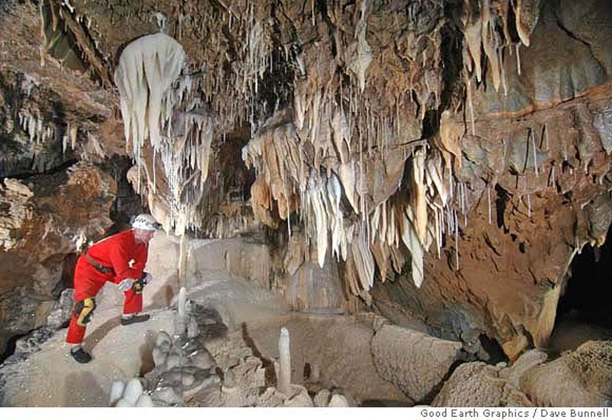 Scott McBride, a cave explorer from San Andreas, stands on a flowstone as he examines stalagmites, stalactites and other rock formations found inside Ursa Minor, the cave he discovered at Sequoia and Kings Canyon National Park. The cave is believed to be about 1 million years old and extends more than 1,000 feet underground. PHOTO BY DAVE BUNNELL, GOOD EARTH GRAPHICS