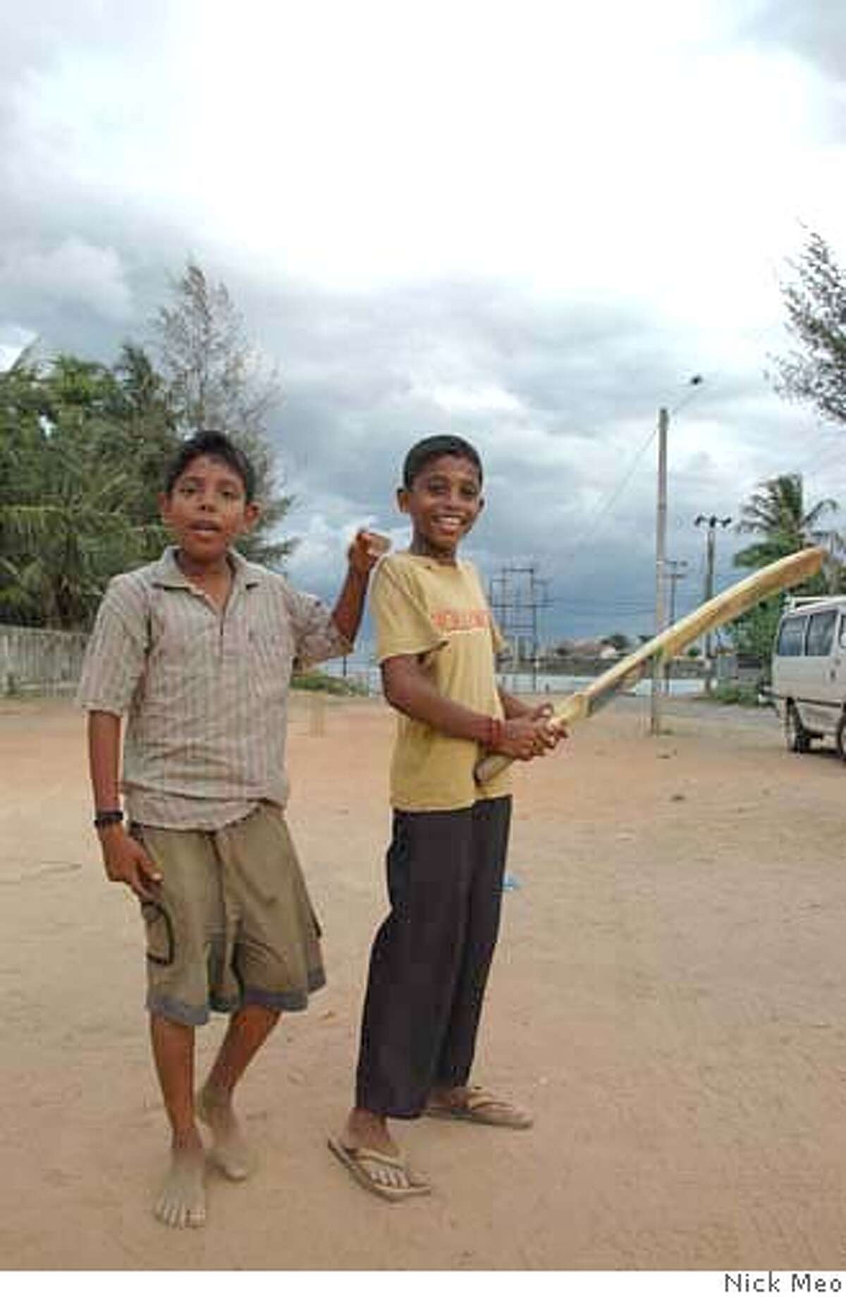 Pictures show boys playing cricket in the town of Batticaloa. Boys not much older than these are recruited by the LTTE. Liberation Tigers of Tamil Eelam are again recruiting children as soldiers as fighting spreads in Sri Lanka . All pix by Nick Meo - in Indonesia on 0062 81584450316