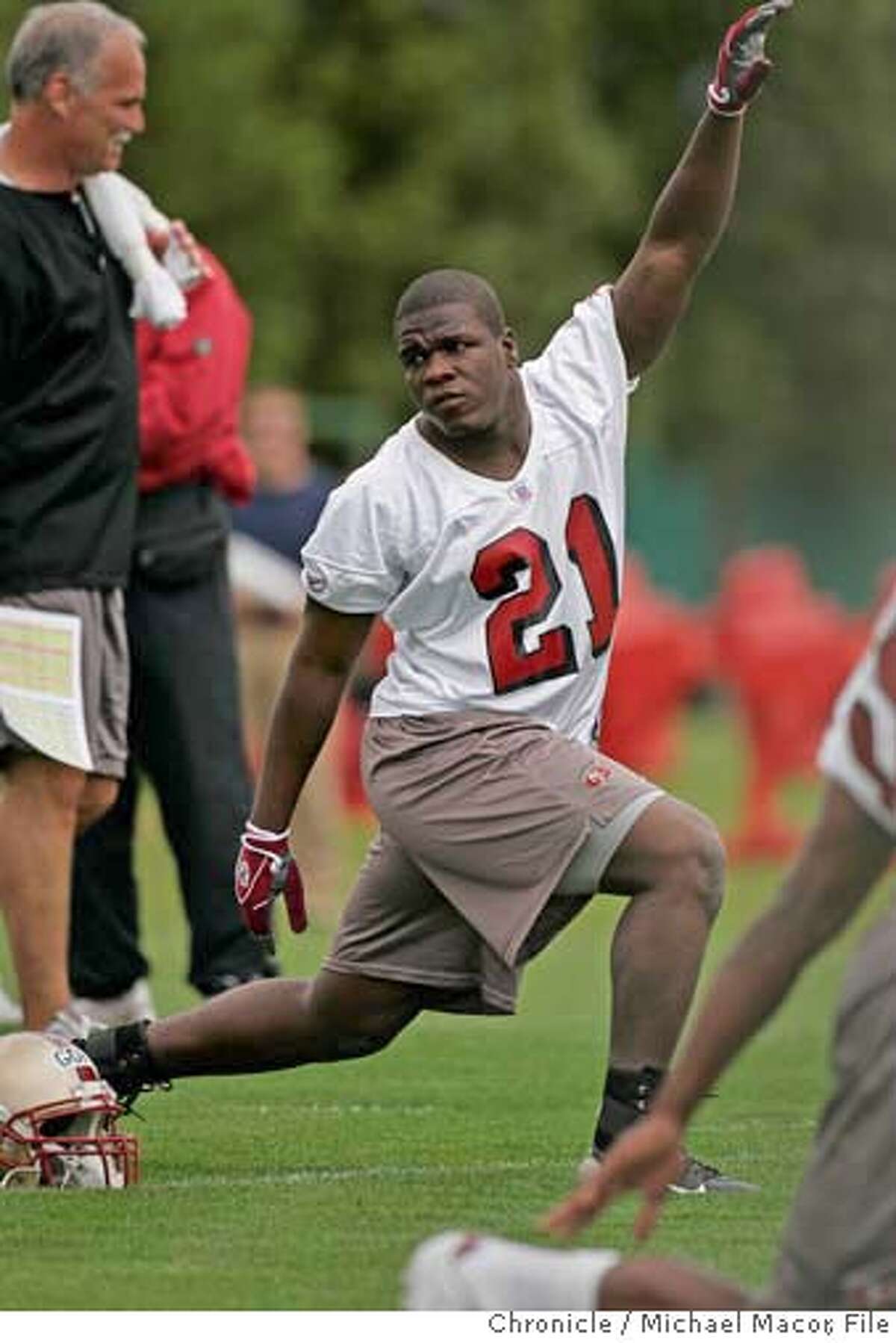 49ers_176_mac.jpg Warm ups, 21-Frank Gore. San Francisco 49ers hold their first mandatory mini-camp of the season. Chance to see new players, coach Mike Nolan at work. 5/6/05 Santa Clara, Ca Michael Macor / San Francisco Chronicle Ran on: 10-21-2005 Frank Gore Ran on: 10-21-2005 Frank Gore Mandatory Credit for Photographer and San Francisco Chronicle/ - Magazine Out
