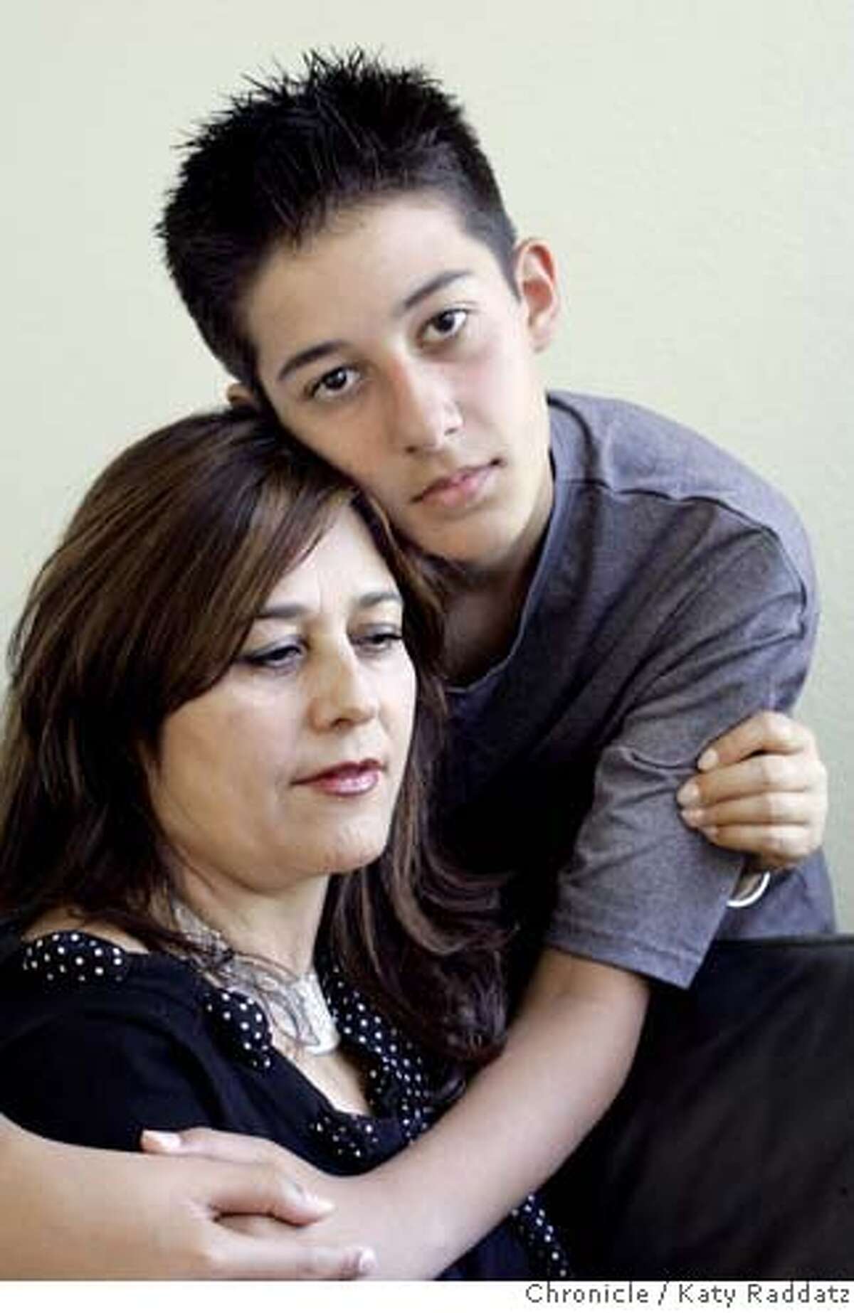 911KIDSB_058_RAD.jpg SHOWN: Wali Ghiassy, age 13, and his mother, Sohaila Azimi, who works with the Afghan Coalition as a health navigator. Story is about how 9/11 has shaped the world of kids. These photos made in Fremont, CA. on Thursday, August 10, 2006. (Katy Raddatz/The S.F.Chronicle) **Wali Ghiassy, Sohaila Azimi Mandatory credit for photographer and the San Francisco Chronicle/ -Mags out