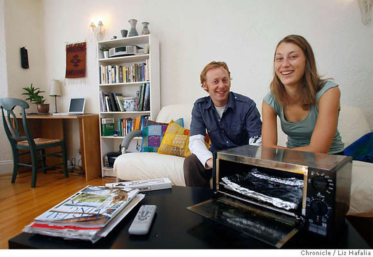keeping_house_apartment_056.JPG This is a first-person story by Nicole Spiridakis who moved to S.F. from Washington, D.C. She and Michael Ross decorated their apartment. They can be seen in their living room with the toaster that Michael had gotten. Liz Hafalia/The Chronicle MANDATORY CREDIT FOR PHOTOGRAPHER AND SAN FRANCISCO CHRONICLE/ -MAGS OUT
