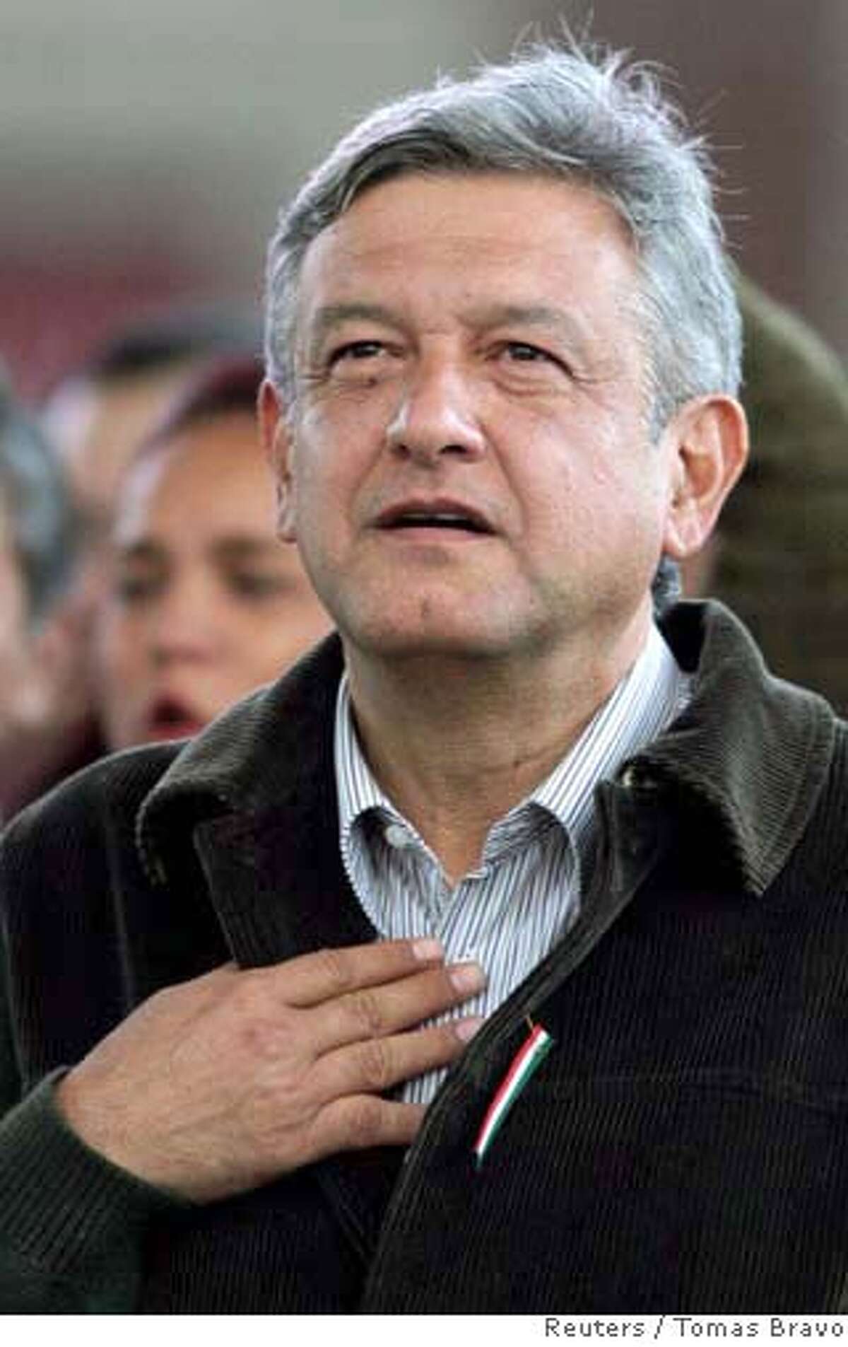 Mexico's Andres Manuel Lopez Obrador, presidential candidate for the Party of the Democratic Revolution (PRD), looks at supporters during a rally in downtown Mexico City, August 28, 2006. Mexico's top electoral court threw out leftists' allegations of massive fraud in last month's presidential election on Monday, handing almost certain victory to conservative candidate Felipe Calderon. REUTERS/Tomas Bravo (MEXICO) 0