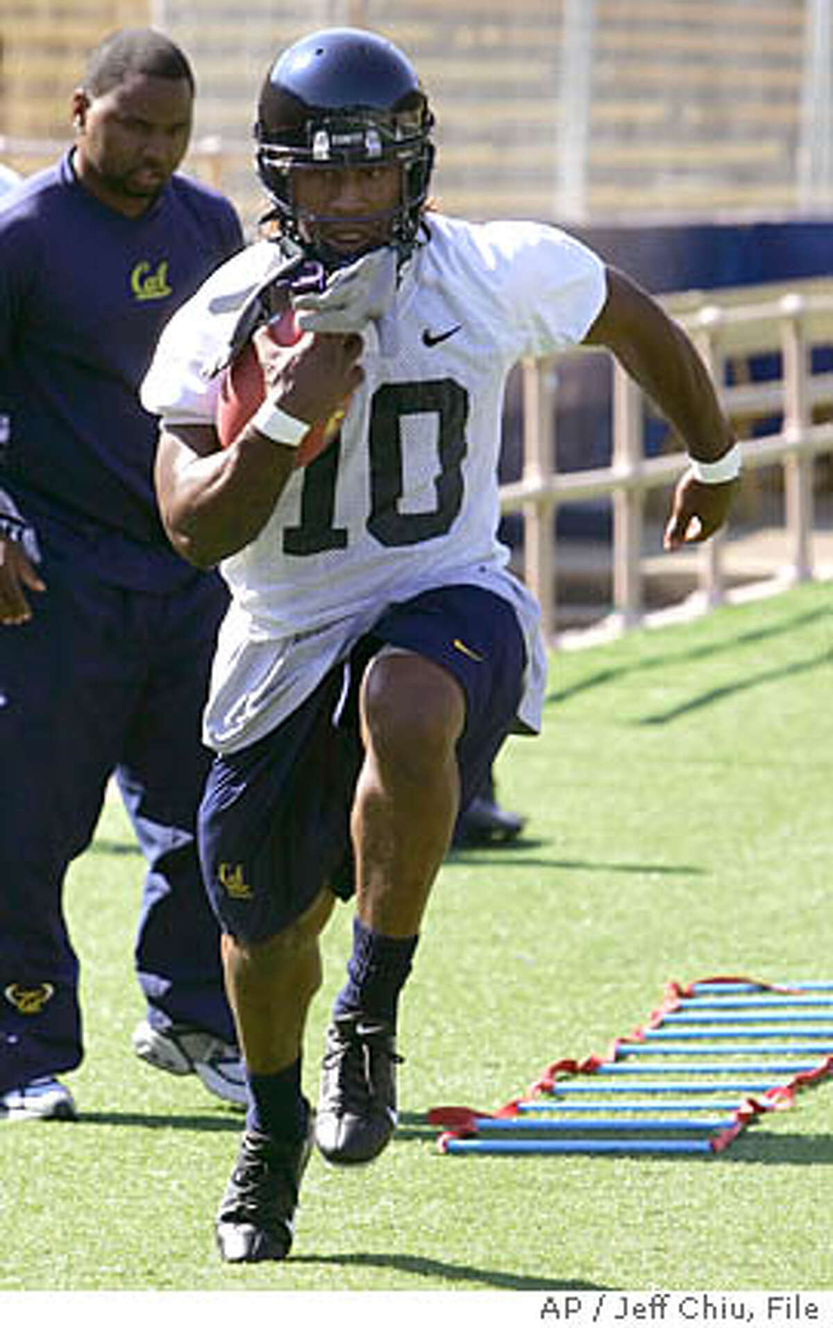 **ADVANCE FOR SUNDAY, AUG. 13 ** California running back Marshawn Lynch runs a drill during football practice in Berkeley, Calif., Tuesday, Aug. 8, 2006. (AP Photo/Jeff Chiu)