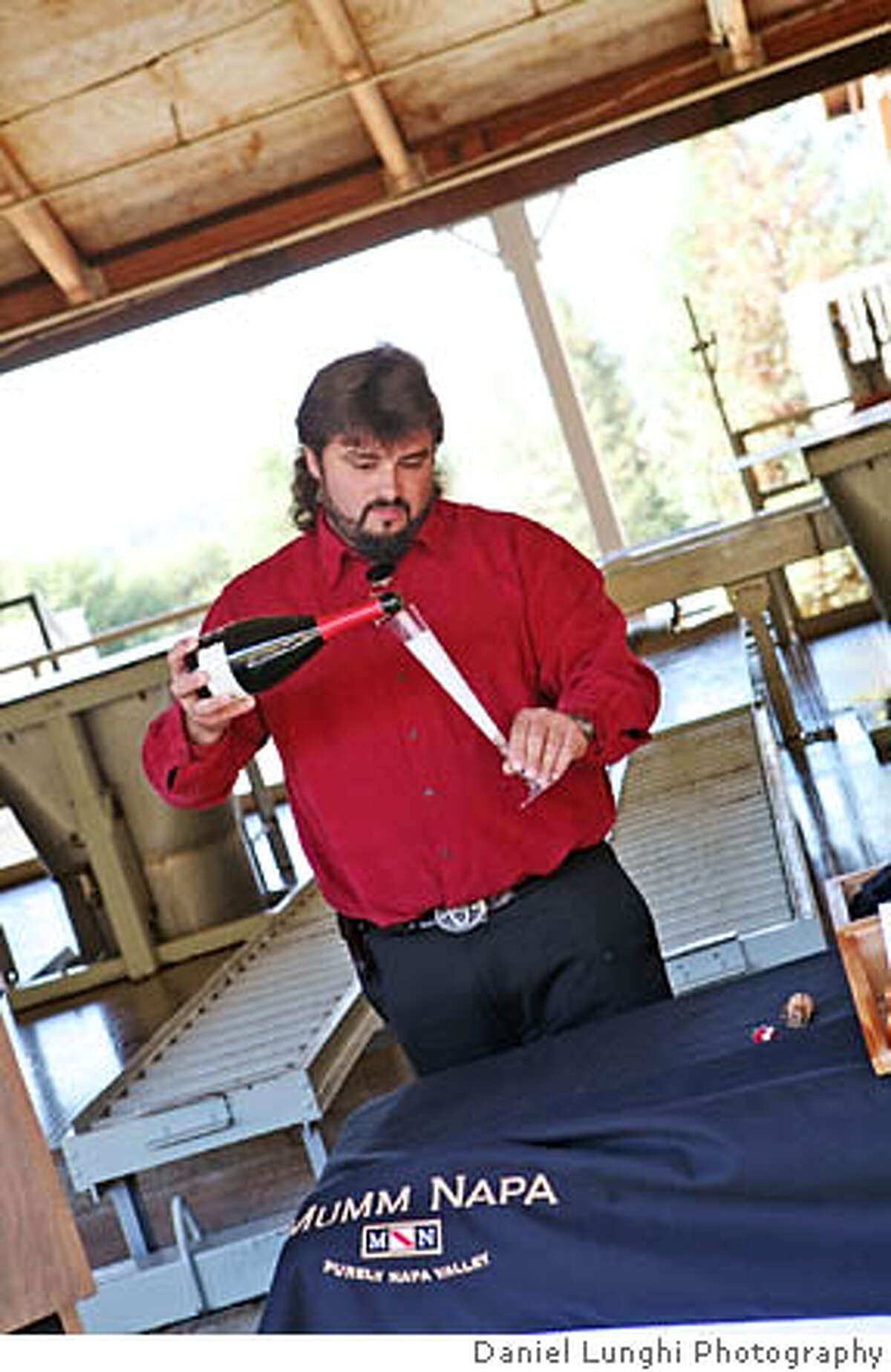 Mumm Napa winemaker Ludovic Dervin toasts the 2006 harvest. Credit: Daniel Lunghi Photography