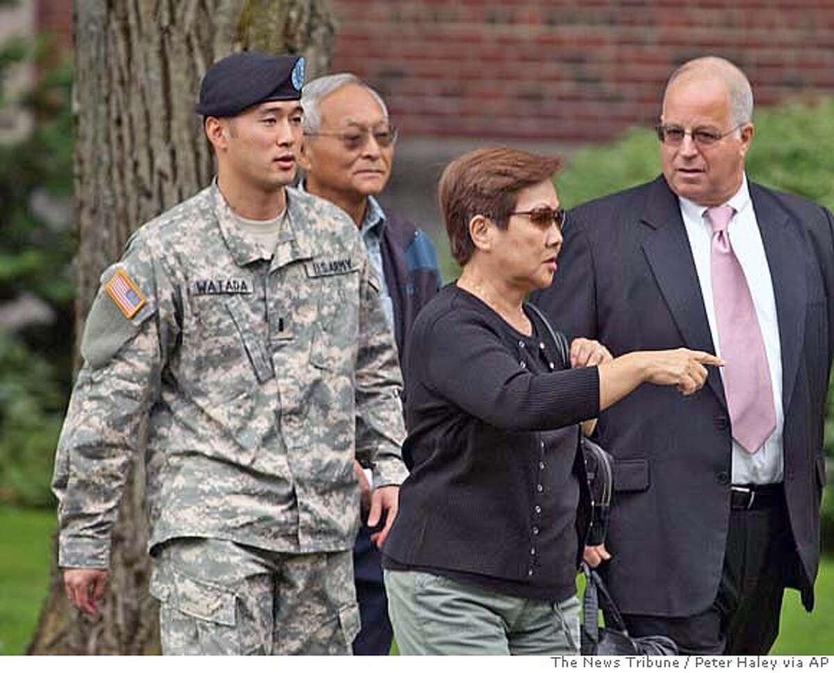 ** CORRECTS NAME OF WOMAN AND RELATIONSHIP ** Army Lt. Ehren Watada, left, walks with father, Bob Watada; his stepmother, Rosa Sakanishi; and attorney, Eric Seitz, during a lunch break in an Army hearing concerning Watada's refusal to deploy to Iraq, at Fort Lewis, Wash., Thursday, Aug. 17, 2006. Watada, 28, of Honolulu, was charged last month with conduct unbecoming an officer, missing troop movement and contempt toward officials. He refused to deploy to Iraq on June 22 with his Stryker unit, the 3rd Brigade, 2nd Infantry Division based at Fort Lewis. (AP Photo/The News Tribune, Peter Haley) CORRECTS NAME OF WOMAN AND RELATIONSHIP