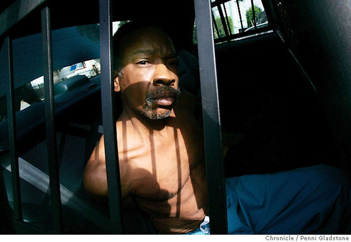 oakcrime Looking out the bars of a police car, Donald May was just arrested on a drug warrant at his home on 83rd Ave. in Oakland by officers of the Oakland Police Department who conducted a series of sweeps through east Oakland drug spots today in attempt to execute 60 felony warrants that have been obtained for drug violations. Event on 8/24/06 in Oakland. Penni Gladstone / The Chronicle