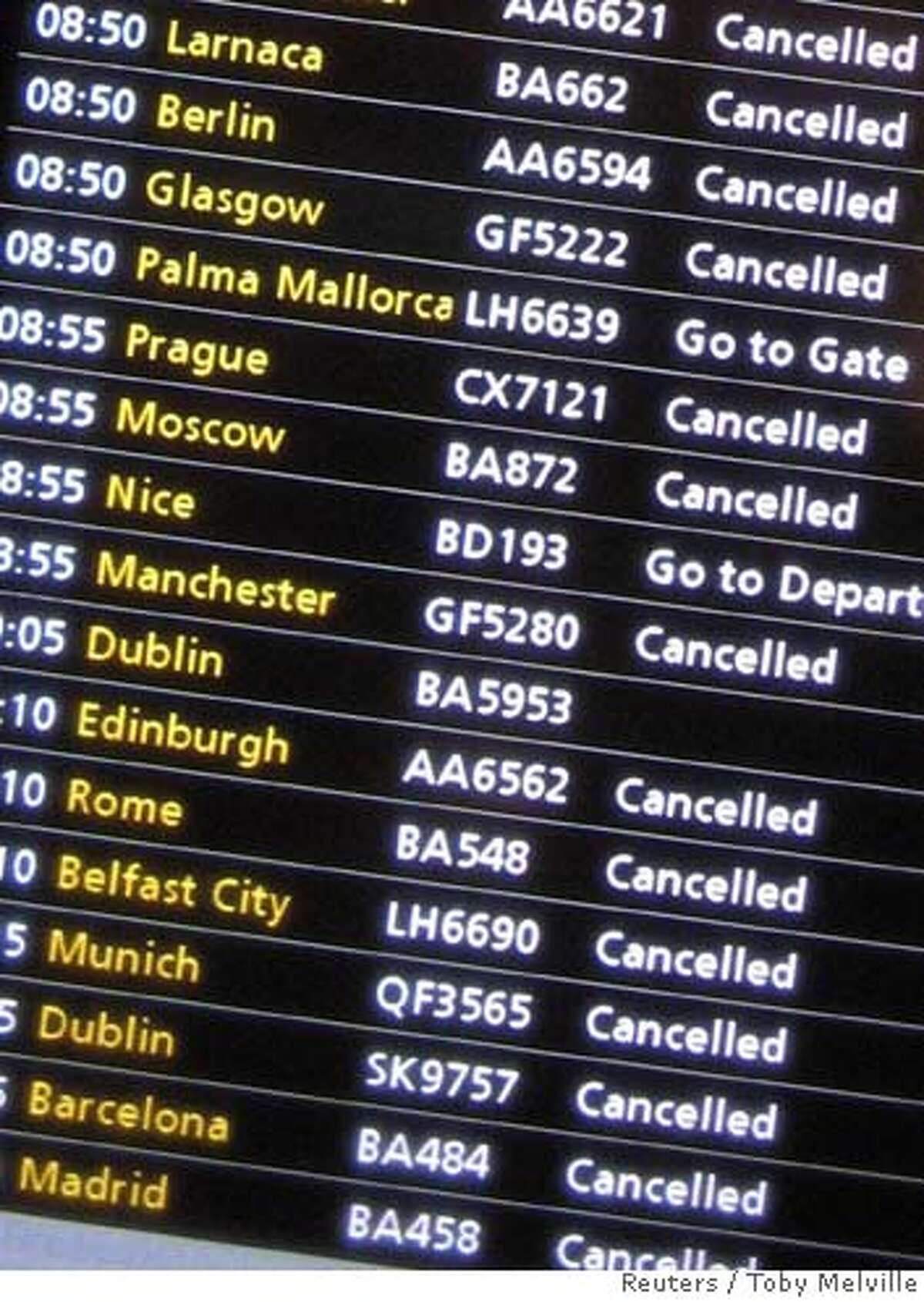 A screen shows cancelled flights at Terminal One of Heathrow Airport in London, August 10, 2006. British police said on Thursday they had thwarted a plot to blow up aircraft in mid-flight between Britain and the United States and arrested more than 20 people. REUTERS/Toby Melville (BRITAIN)