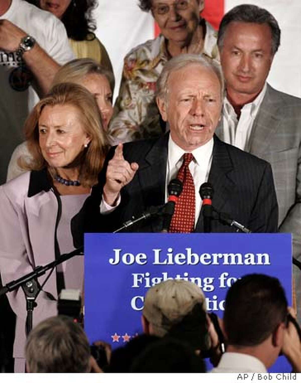 Incumbent party-endorsed Democratic U.S. Sen. Joseph I. Lieberman makes a point as he spoke in Hartford, Conn., Tuesday, Aug. 8, 2006 after he was defeated in a primary by Ned Lamont. Lieberman said he would run as an independent. His wife Hadassah is at left. (AP Photo/Bob Child)
