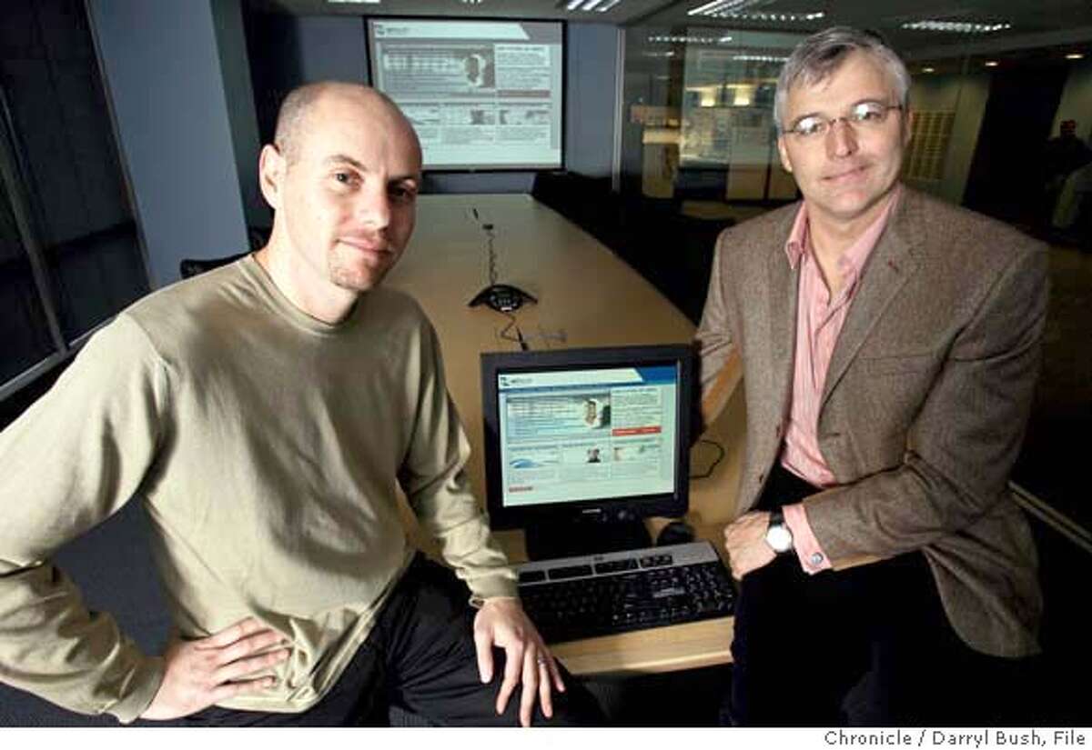 software25_0004_db.jpg NetSuite's Evan Goldberg CTO and chairman, left, and Zach Nelson, CEO, with the companies home page displayed on the computer projection system in NetSuite offices. Event on 12/21/05 in San Francisco. Darryl Bush / The Chronicle Ran on: 12-25-2005 Evan Goldberg, chairman of NetSuite in San Mateo (left) and CEO Zach Nelson, produce software to run most financial aspects of a small to midsize business. MANDATORY CREDIT FOR PHOTOG AND SF CHRONICLE/ -MAGS OUT