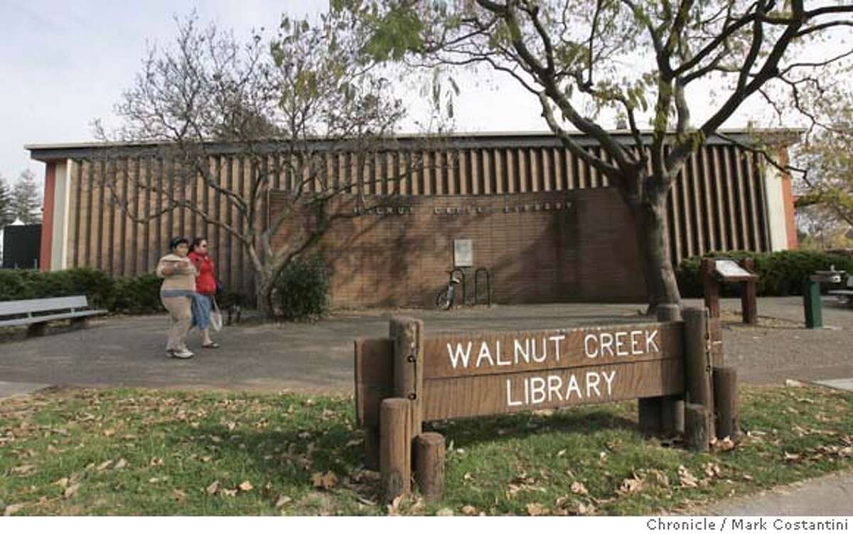 Exterior of library. Walnut Creek wants a big new library to replace the aging one in its upscale downtown. Please get a photo/photos of the current Walnut Creek library Event on 12/12/05 in Walnut Creek. Photo: Mark Costantini /San Francisco Chronicle. Ran on: 12-13-2005 Rebecca Fisher helps daughter Alexandra, 2, pick out a book from the cart with childrens titles at the Walnut Creek library. Ran on: 12-13-2005 Rebecca Fisher helps daughter Alexandra, 2, pick out a book from the cart with childrens titles at the Walnut Creek library.Ran on: 03-01-2006 Above: Rebecca Fisher and her daughter Alexandra, 2, look over childrens books at the Walnut Creek library. Left: The citys 1960s-era downtown library is outdated, according to many residents, but there is disagreement on how to pay for a state-of-the-art replacement.
