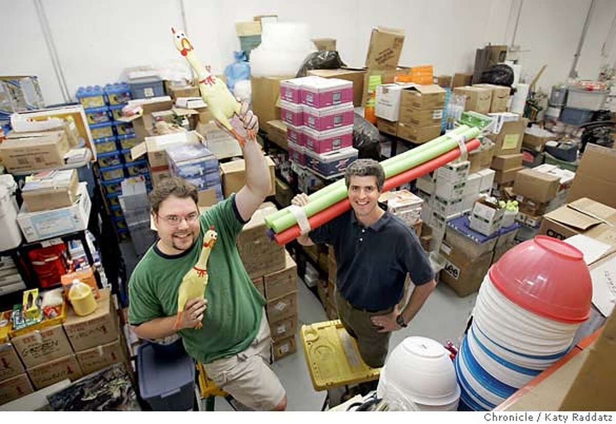 .JPG SHOWN: L: Tim Horvat, a warehouse assistant; R: Glen Tripp, CEO of Camp Galileo. They are posing with rubber chickens (their company mascot) and pool noodles, surrounded by just SOME of the vast quantity of stuff they deal with. Story is about the huge quantity and variety of STUFF it takes to run a camp. Camp Galileo is the name of the company that is in the business of running a summer camp. Photo shot in Berkeley, CA. on Monday, June 5, 2006. (Katy Raddatz/The Chronicle) Photo taken on 6/5/06, in San Francisco, CA. **Tim Horvat, Glen Tripp
