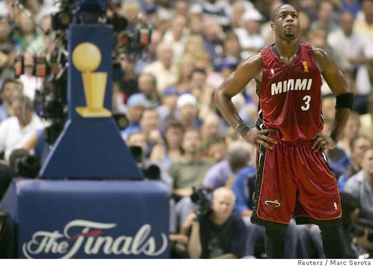 Miami Heat guard Wade takes break during first half action in Game 1 of 2006 NBA Finals against Dallas Mavericks in Dallas