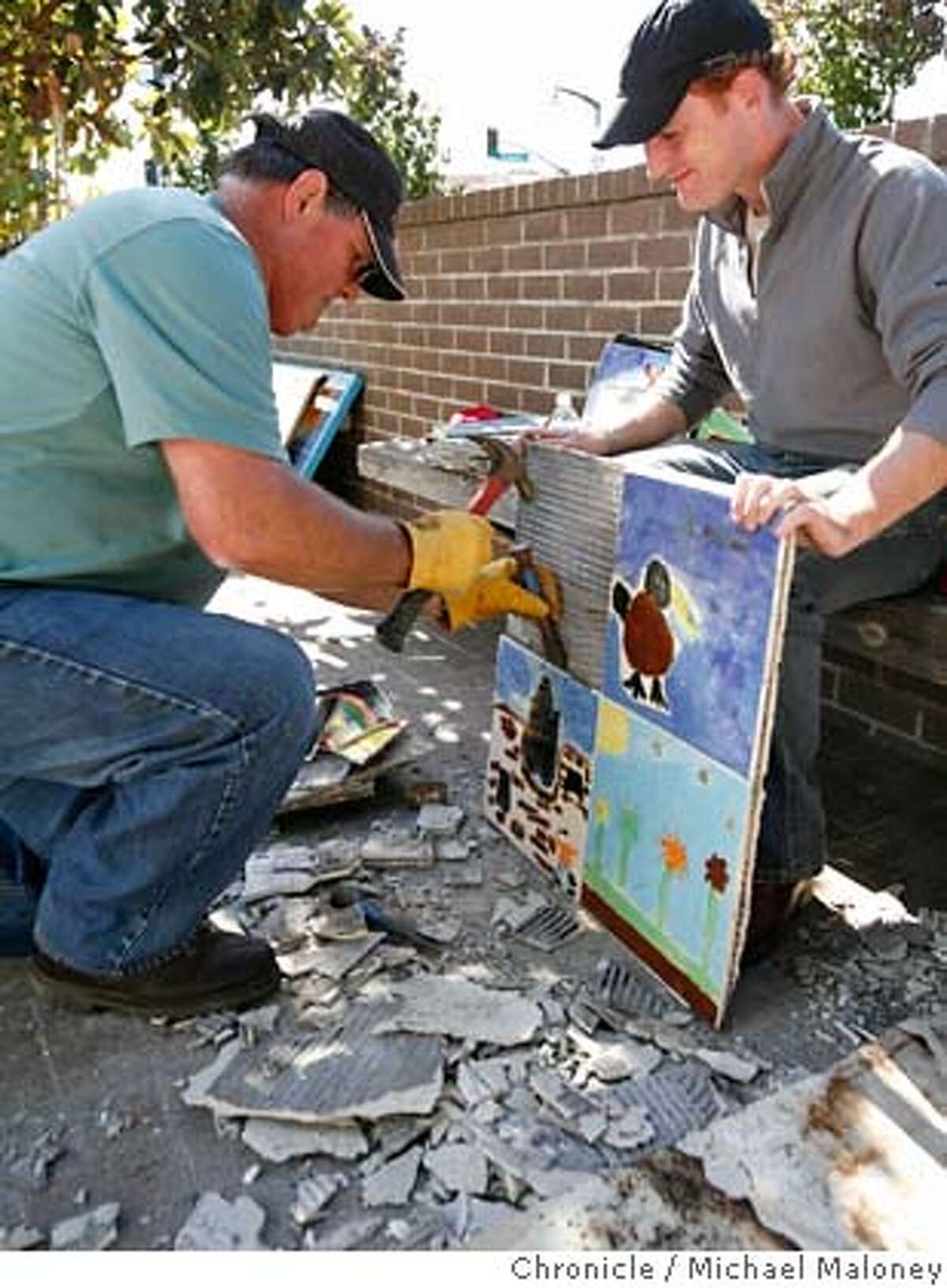Rick Story (left) and Patrick Curran of the SWA Group carefully pry off tiles that were used in garden beds and are now to be recycled as table tops in the Bayview Opera House. On Friday Oct. 19, a ceremony will celebrate a public-private partnership creating a major facelift for one of San Francisco�s historic landmarks, the Bayview Opera House. Locally-based SWA Group, a landscape architecture firm is leading a pro-bono implementation in celebration of the firm�s 50th anniversary. The community celebration on Friday culminates a two-day transformation of the Bayview Opera House grounds on Third Street in San Francisco. Photo taken on 10/18/07. Photo by Michael Maloney / San Francisco Chronicle ***Rick Story, Patrick Curran MANDATORY CREDIT FOR PHOTOG AND SF CHRONICLE/NO SALES-MAGS OUT