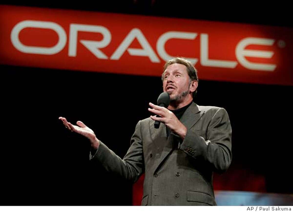 **FILE**Oracle Corp. chief executive Larry Ellison gestures at his keynote address at Oracle Open World Conference in a San Francisco file photo from Sept. 21, 2005. Business software maker Oracle Corp. will buy Hyperion Solutions Corp. for $3.3 billion in cash, renewing a shopping spree aimed at toppling rival SAP AG. The deal announced Thursday, March 1, 2007 will give Oracle control of Hyperion technology that help companies track their business performance _ tools that are widely used by many of SAP's customers.(AP Photo/Paul Sakuma, File) Ran on: 03-09-2007 Buffett SEPT. 21, 2005 FILE PHOTO