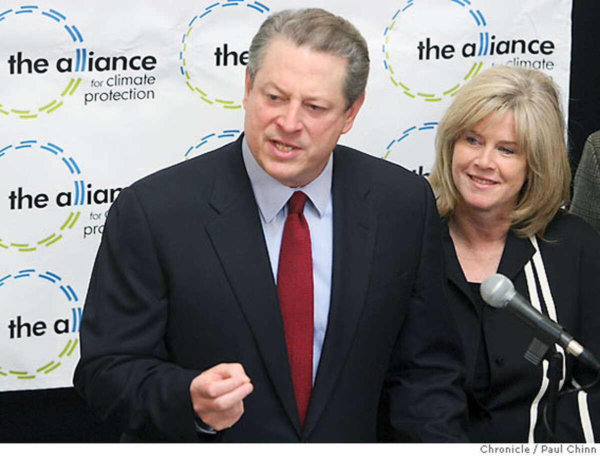 Former vice president Al Gore and his wife Tipper react to the announcement that he has won a share of the Nobel Peace Prize at a news conference at the Alliance for Climate Protection in Palo Alto, Calif. on Friday, Oct. 12, 2007. PAUL CHINN/The Chronicle **Al Gore, Tipper