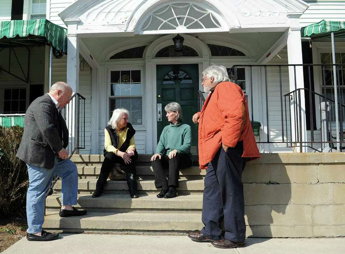 Area preservationists chat outside the Sterling Farms farmhouse which they recently fought to save from demolition. From left are Marshall Millsap, Renee Kahn, Cynthia Reeder and William Bretchger. Millsap and Bretchger are members of the Old Long Ridge Historic District Commission. Kahn and Reeder are members of the Historic Neighborhood Preservation Program.
