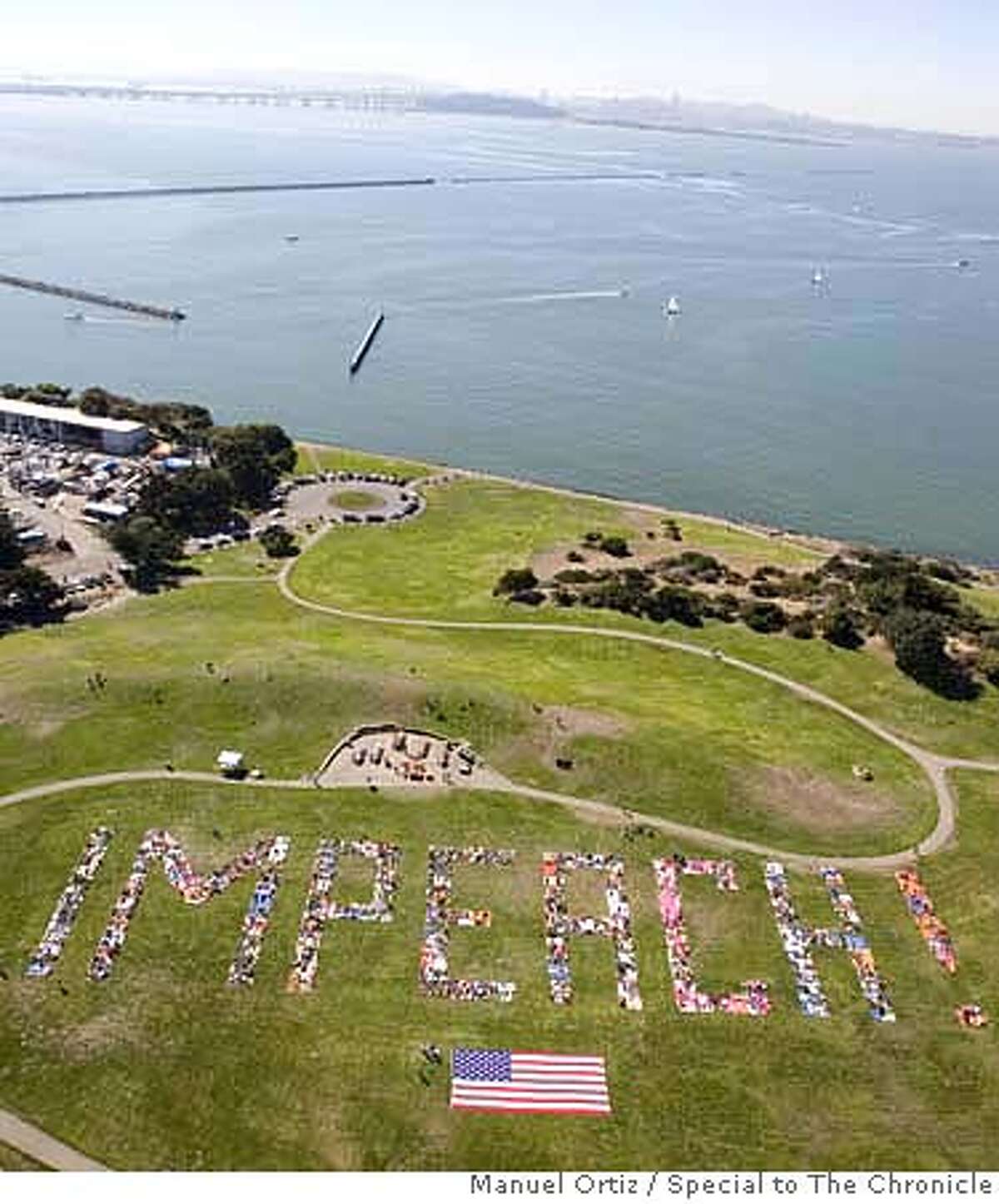 Beach Impeach � Thousands Spell out "IMPEACH!" at Cesar Chavez Park in Berkeley, October 7, 2007. CR: Manuel Ortiz/Special to The Chronicle