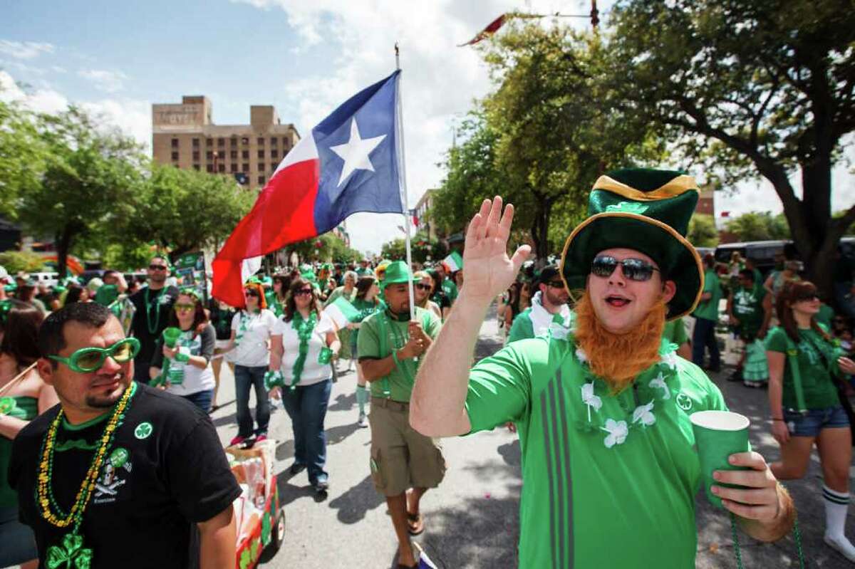Brian Somner waves as he walks with members of the Sons of Ireland Houston during the 53rd Annual St. Patrick's Parade through downtown Houston on March 17. The two-hour parade has historically been one of the largest in the U.S. and each year includes over 100 entries to delight the Irish and Irish-at-heart.